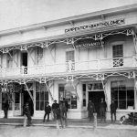 Egbert Carpenter gambled on Charlevoix’s future growth in early 1872 when he built an isolated store near the southwest corner of Round Lake. From Clinton Street south, woods still covered the land. It was easier to reach the back end of Carpenter’s store via Round Lake than over a rough path cut through the trees for access to the post office. But within a few months this structure became one of many, for throughout the rest of 1872 Charlevoix experienced a boom when 50% of the buildings in town went up. East Park’s new band shell now occupies this site. Carpenter & Bartholomew 1872