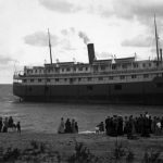 The passenger liner Illinois ran aground on a stormy August 26, 1906 with about 500 passengers and crew. She sped for the piers just as a schooner was heading in also. The captain of the Illinois saw he was on a collision course, swerved, and overshot the piers to crunch onto the sand. The Life-Saving Service rigged a breeches buoy from the south pier and managed to take off about 135. But this was not fast enough, so rescue boats were launched. In terrible conditions, the Life-Savers took off the other 365 throughout the night, with no injuries or loss of life Passenger liner beached on Lake Michigan
